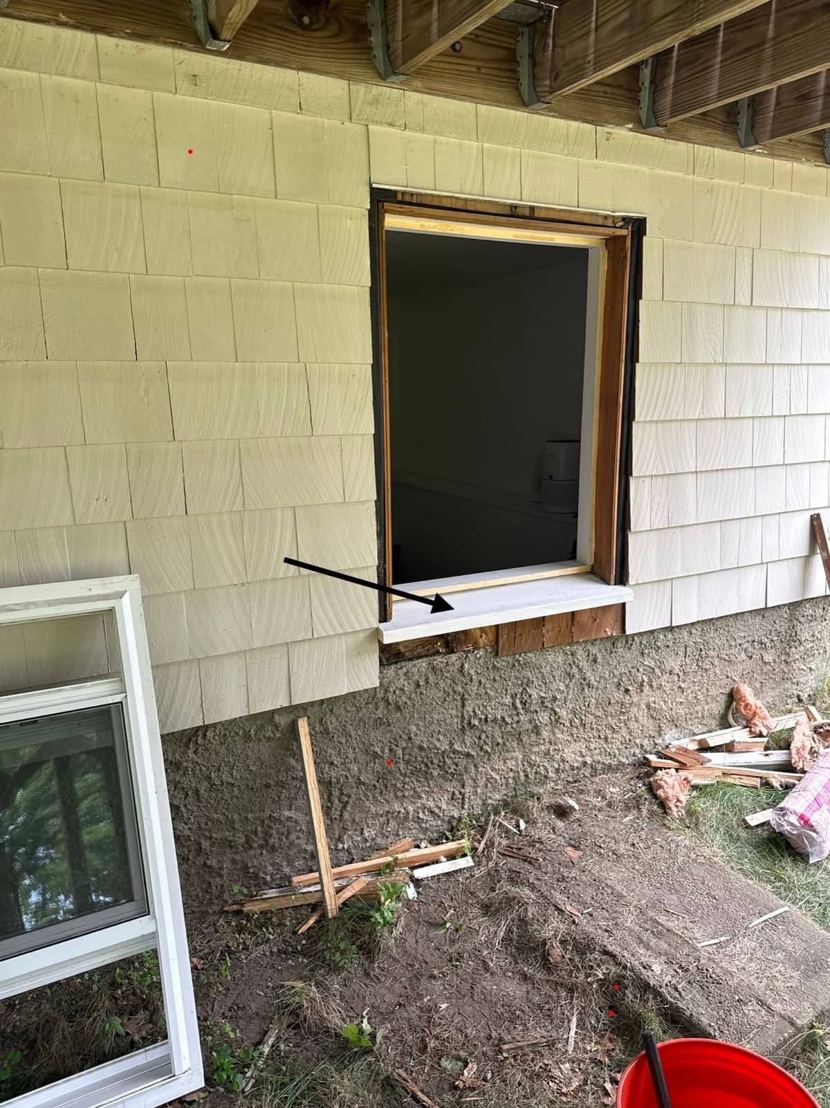 New custom-built sill in, before trim and shingles go back on.