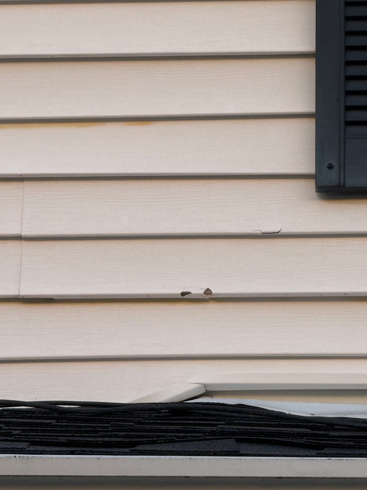 Before: siding repair project in Stoughton, MA